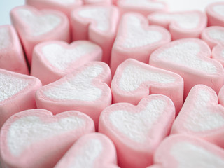 Fototapeta na wymiar Pink marshmallow close up background, Many hearts marshmallows closeup, Sweets in the form of hearts of marshmallow. Valentine's Day Gift
