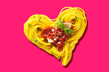 Hart-shaped pasta on pink background
