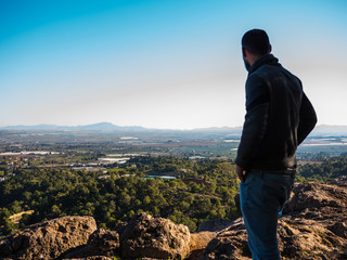 Fototapeta premium young guy looking at landscape