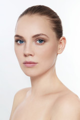Fototapeta premium Portrait of young beautiful girl with clean make-up