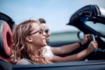 close up.couple traveling in their convertible car