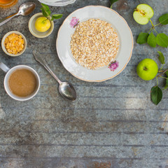 oatmeal, oat flakes, coffee for breakfast (table set). Top Food background