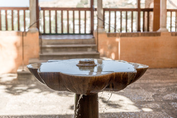 Obraz premium Water fountain in one of the buildings of the Alhambra, Granada
