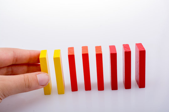 Hand holding color dominoes