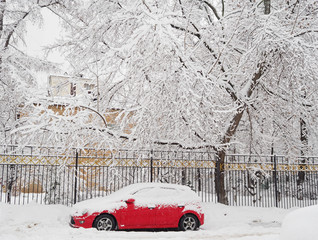 Snow covered car after heavy snowfall