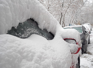 Snow covered car after heavy snowfall