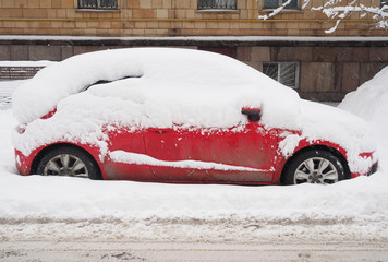 Snow covered car after heavy snowfall