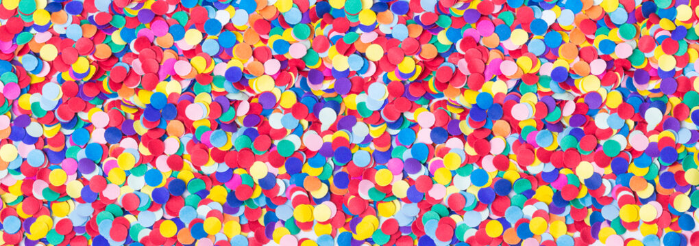 Colorful, round confetti as background for carnival, New Year's Eve, banner