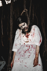 Portrait of asian woman make up ghost face with blood,Horror scene,Scary background,Halloween...