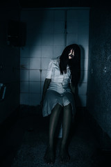 Portrait of asian woman make up ghost face with blood,Horror scene,Scary background,Halloween...