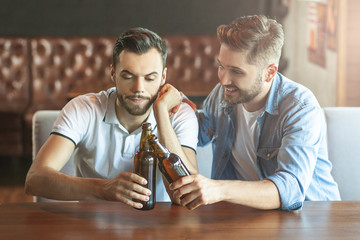 friends clicking with beer bottles