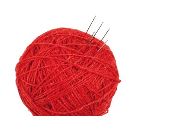 Ball of yarn with needles in it
