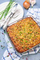 Potato kugel gratin in a glass pan.