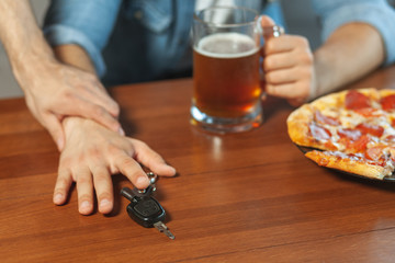 man holding hand of friend with car keys