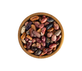Kidney beans isolated on white background. Top view. Kidney beans in a wooden bowl isolated on white background. Kidney beans with copy space for text.