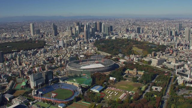 Tokyo, Japan circa-2018.  Aerial view of Shinjuku and Olympic Stadium.  Shot from helicopter with RED camera.