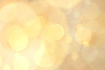 Holiday background. Abstract blurred festive background texture for Christmas or holidays with bokeh defocused golden lights.