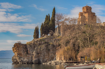 A landscape of Lake Ohrid with a view of St. John the Theologian Canео on the Rock. One of the most famous churches in Ohrid, Macedonia.