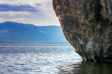 Landscape of Lake Ohrid with the giant rock on which the Church of St John the Baptist Canneo was...