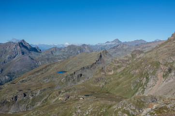 Mountain panorama of Aosta Valley from Monte Rosa massif near Punta Indren. Alagna Valsesia area, Italy