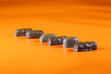 Chocolate blocks on an orange background