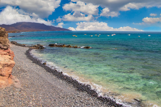 Stone beach of Puerto de la Cruze at Canary Islands, Fuerteventura, Spain.