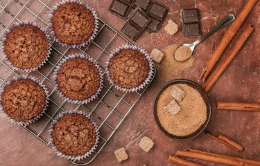 Chocolate muffins with Demerara sugar and cinnamon close-up. Selective focus - Powered by Adobe