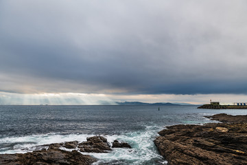 Cliffs and small lighthouse in Pontevedra, Spain