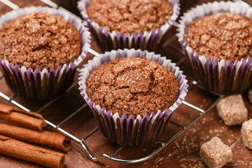 Chocolate muffins with Demerara sugar and cinnamon close-up. Selective focus