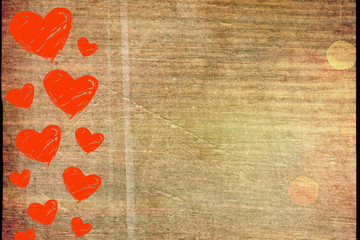 Red hearts on the left border on a wooden background with space for text. Valentine`s day background.Lots of red hearts on dark brown rustic weathered wooden background, top view
