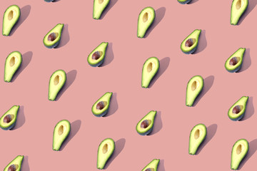 Many halves of avocado, pattern, banner. The procurement of bright background, red coral pastel...