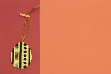 Decorative exclusive egg on jute cord with a clothespin on contrasting russet and terracotta...
