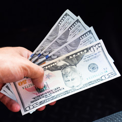 Hand transmitter dollars. Transferring money out of the hands. A