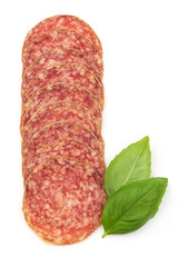 Sliced Salami. Thin Smoked sausage slices with basil, isolated on a white background. Top view