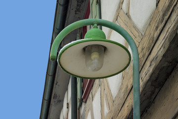 Old street lantern lamp on wall. Day time. No people. - 243735076