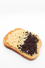 Delicious natural looking toast with Dutch chocolate sprinkles on isolated white background