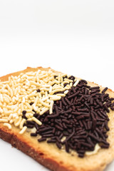 Delicious natural looking toast with Dutch chocolate sprinkles on isolated white background