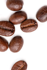 Macro of coffee beans on white background. Selective focus