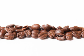 Macro of coffee beans on white background. Selective focus