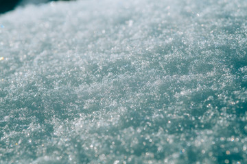 Blue winter snow snowflake shiny glow close up outdoor background