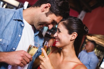 Couple enjoying champagne in nightclub