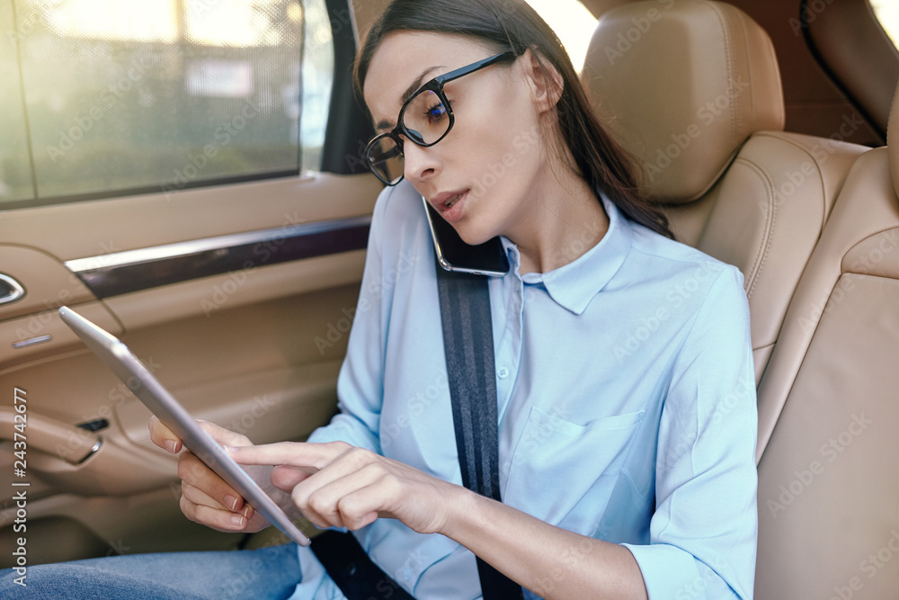 Wall mural businesswoman talking on smartphone