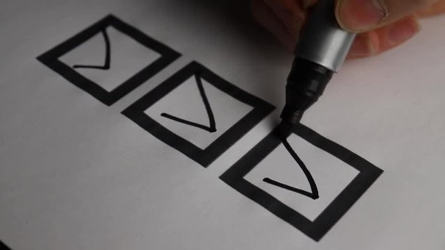 Checking off a to do list. Check all the boxes of a checklist