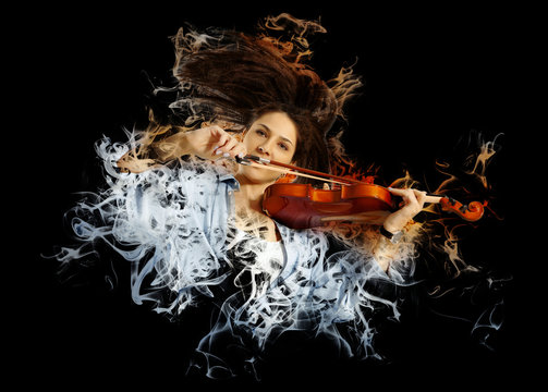 Woman playing violin on smoke background