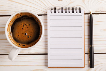 Blank open notebook with coffee cup, Business template mock up for adding your text. Business still life concept with office stuff on table.