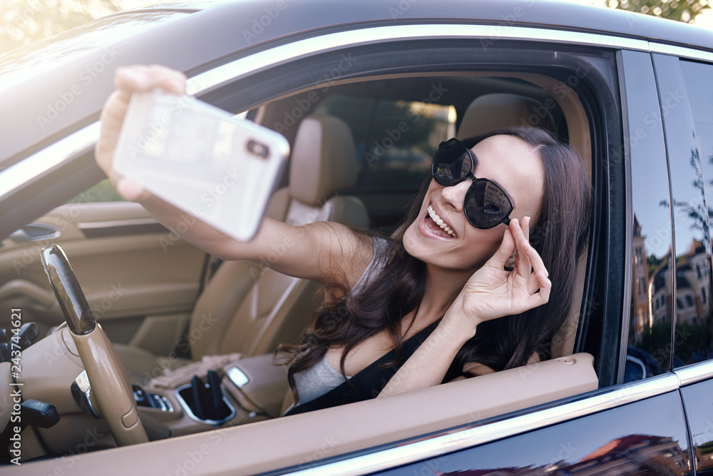 Poster woman taking selfie on smartphone