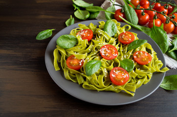 spinach tagliatelle with cherry tomatoes. proper diet.