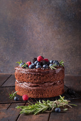 Chocolate cake with berries: raspberries, blueberries, blackberries