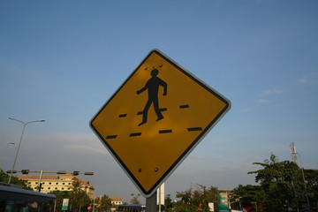 Siem Reap,Cambodia-Januay 9, 2019: A pedestrian crossing sign on National Highway 6 in Siem Reap, Cambodia
