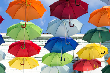 blue, white, red, yellow umbrellas
